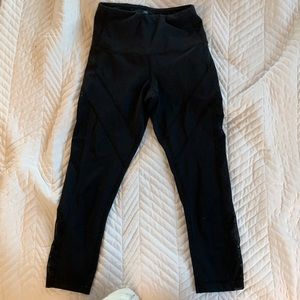 A extra small black 90° leggings with a mesh sides